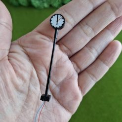 Lámpara reloj a escala