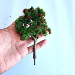 Árbol frutal rojo a escala
