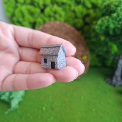 Casa rocosa a escala